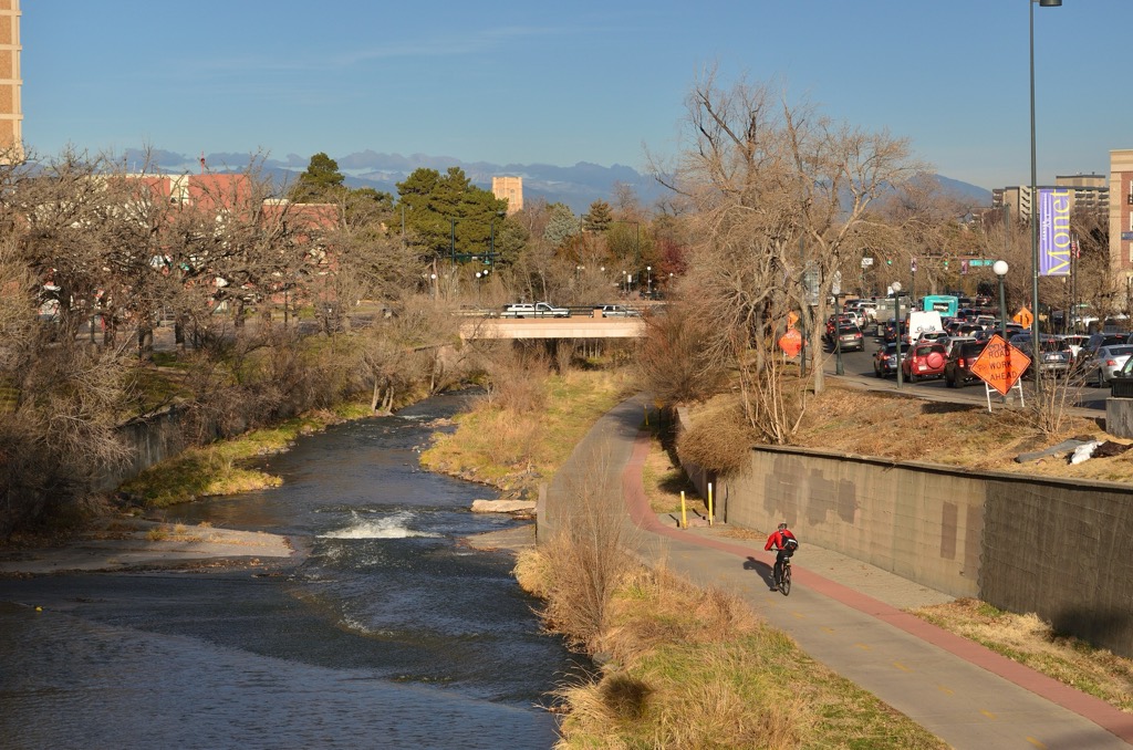 The Cherry Creek Trail beside the creek near Speer Boulevard, with the foothills in the distance