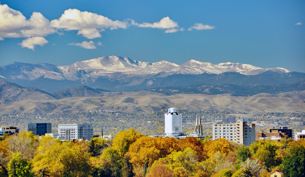 Snow-capped peaks above the Denver metro in autumn